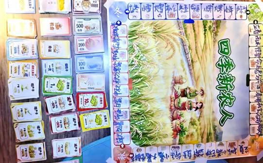 图为《四季新农人》桌游道具，涵盖节气、土地与农事的趣味卡片